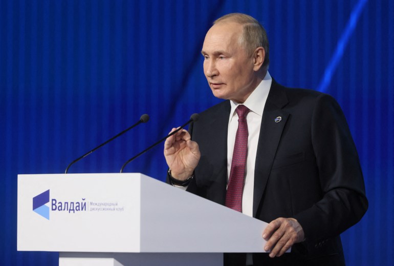 Putin speaking at podium