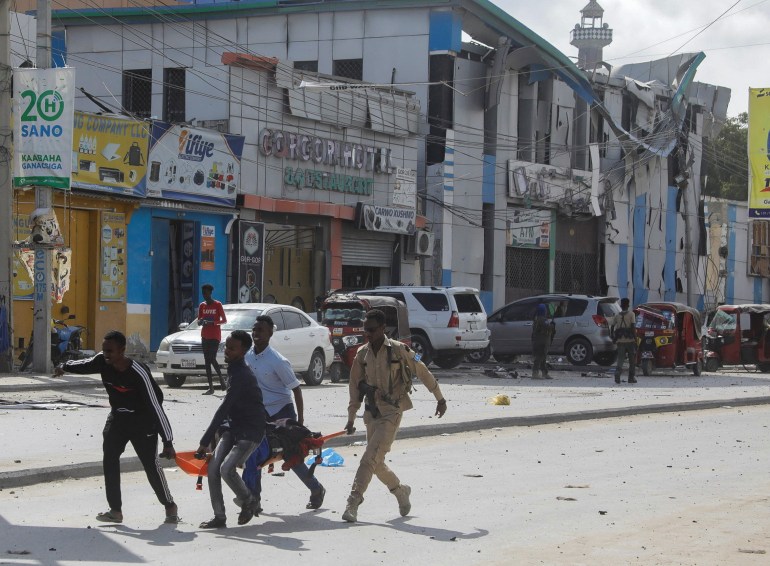 An injured civilian is evacuated from the scene of an explosion near the education ministry building along K5 street in Mogadishu, Somalia October 29, 2022. 