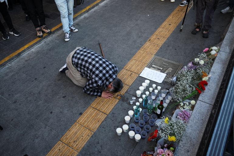 A person pays tribute near the scene of the stampede during Halloween festivities, in Seoul, South Korea, October 30, 2022