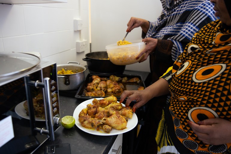 Women cooking together at the centre.
