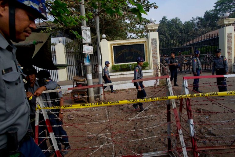 Police barricades outside Insein prison on the outskirts of Yangon, Myanmar, in 2015. Two explosions at the prison on Wednesday are reported to have killed at least eight people, according to media reports [File: Gemunu Amarasinghe/AP]