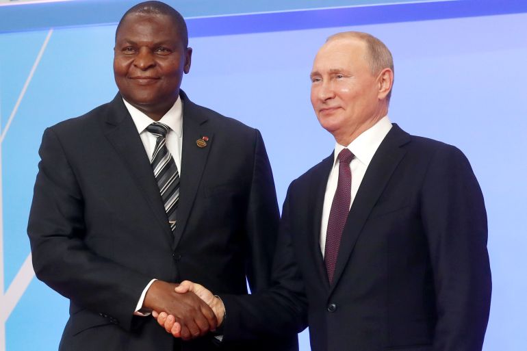 Russian President Vladimir Putin, right, and President of the Central African Republic Faustin Archange Touadera pose for a photo during a welcome ceremony of the Russia-Africa summit in the Black Sea resort of Sochi, Russia, Wednesday, Oct. 23, 2019. (AP Photo/Sergei Chirikov, pool photo via AP)