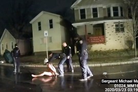 An image from police body camera video shows Rochester police officer putting a hood over the head of Daniel Prude in Rochester, NY [Rochester Police via Roth and Roth LLP via AP]