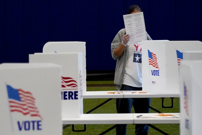 A person checks their ballot in the 2020 election
