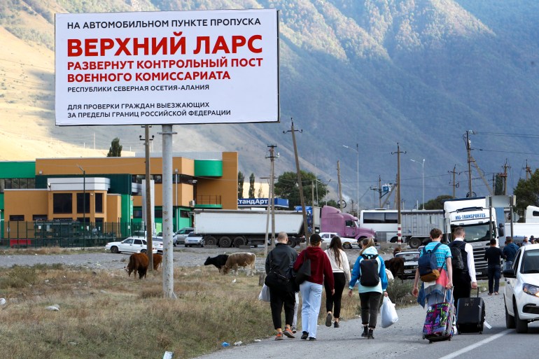 Russians crossing the border to Georgia.
