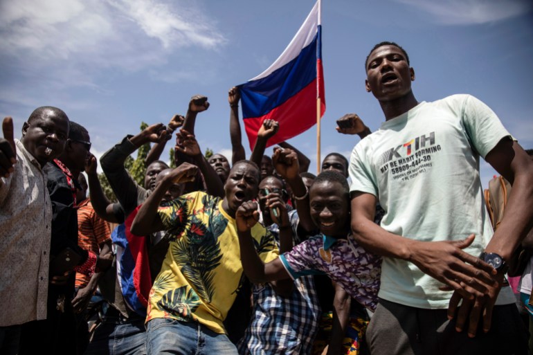 Young men chant slogans against the power of military leader Paul-Henri Damiba.