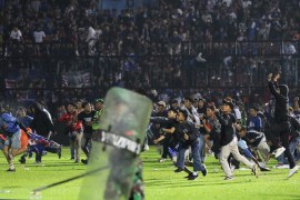 Football fans enter the ground during a clash between supporters at Kanjuruhan Stadium in Malang, East Java, Indonesia, October 1, 2022 [Yudha Prabowo/AP Photo]