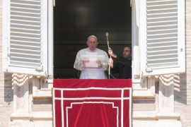Pope Francis reads a message during the Angelus noon prayer from the window of his studio overlooking St Peter&#39;s Square, Vatican, October 2, 2022 [Alessandra Tarantino/AP Photo]
