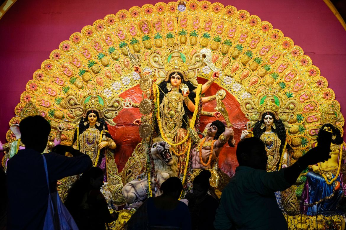 People offer prayers at a makeshift worship venue on the first day of Durga Puja festival in Kolkata