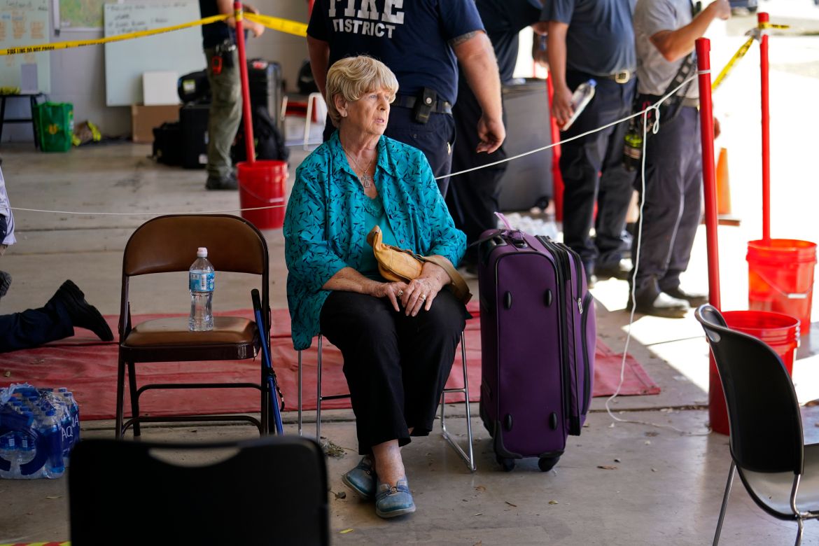 Linda Newman, a resident of Pine Island who rode out the storm on the island and recently lost her husband, waits to be evacuated in the aftermath of Hurricane Ian on Pine Island in Lee County