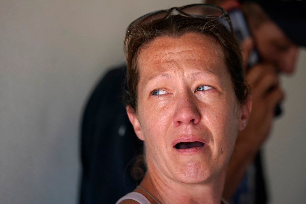 Melanie Kayson, a resident of Pine Island who rode out the storm on the island, cries as she is evacuated in the aftermath of Hurricane Ian on Pine Island