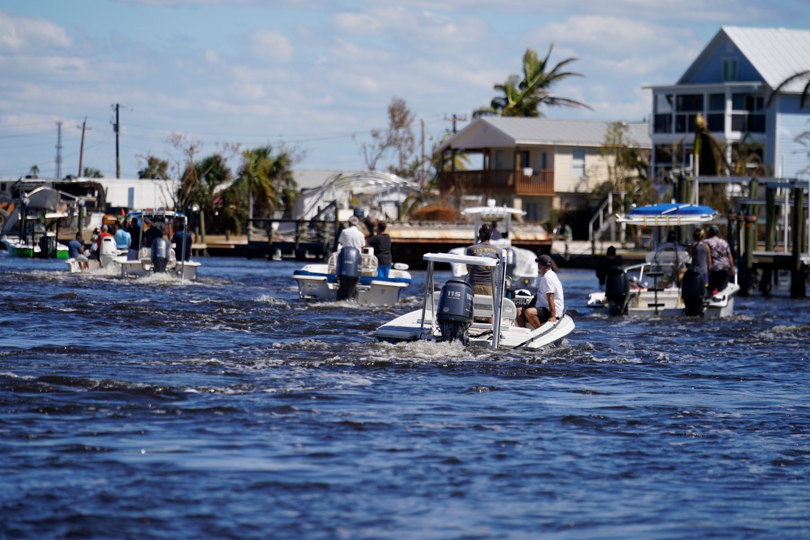 Boats operated by resident good Samaritans help evacuate residents who stayed behind on Pine Island, in the aftermath of Hurricane Ian in Matlacha