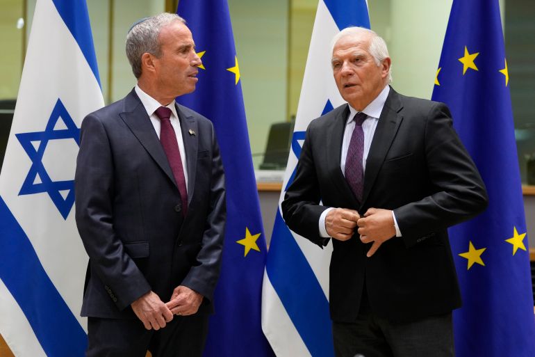 European Union foreign policy chief Josep Borrell, right, greets Israel's Minister of Intelligence Elazar Stern prior to a meeting of the EU-Israel Association Council at the EU Council building in Brussels