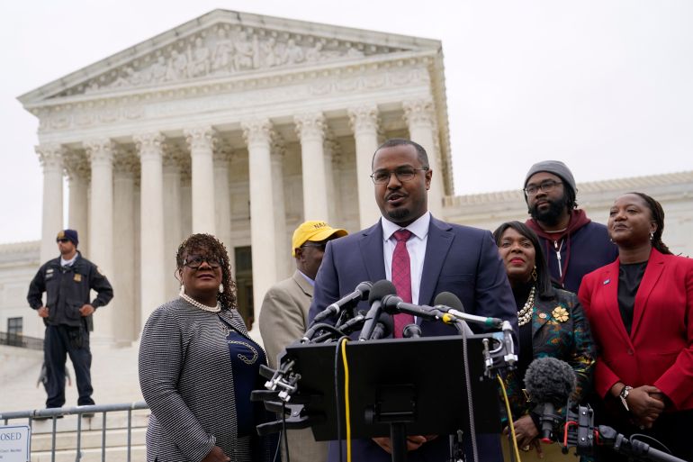 Deuel Ross, centre, plaintiff's counsel in Merrill v Milligan, an Alabama redistricting case that could have far-reaching effects on minority voting power across the United States, speaks with members of the press following oral arguments outside the Supreme Court on Capitol Hill in Washington, DC, October 4, 2022
