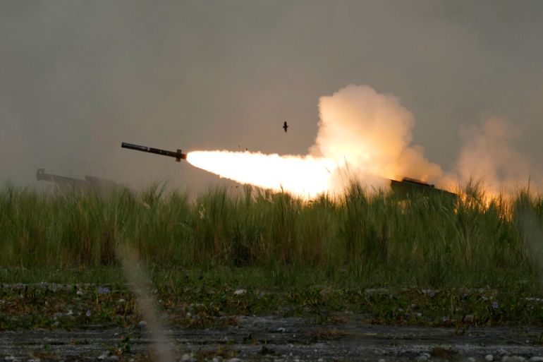 A US M142 High Mobility Artillery Rocket System (HIMARS) fires a missile during annual combat drills between the Philippine Marine Corps and US Marine Corps in Capas, Tarlac province, northern Philippines on October 13, 2022 [Aaron Favila/AP]