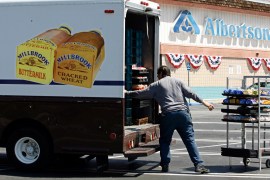 Mitch Maddox, a bread route salesman, loads bread outside the Eagle Rock Albertsons store in Los Angeles, US