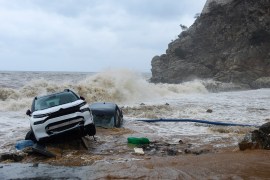 Cars abandoned by the sea following heavy thunderstorms, in the village of Paliokastro, on the island of Crete, Greece, Saturday, Oct. 15, 2022. It has been reported that at least one person has died with others missing due to the severe flooding. (AP Photo/Harry Nakos)