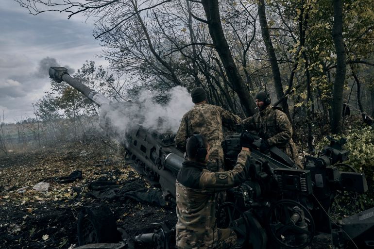 Ukrainian soldiers fire at Russian positions from a U.S.-supplied M777 howitzer in Ukraine's eastern Donetsk