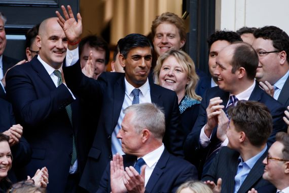 Rishi Sunak, top centre, waves after winning the Conservative Party leadership.