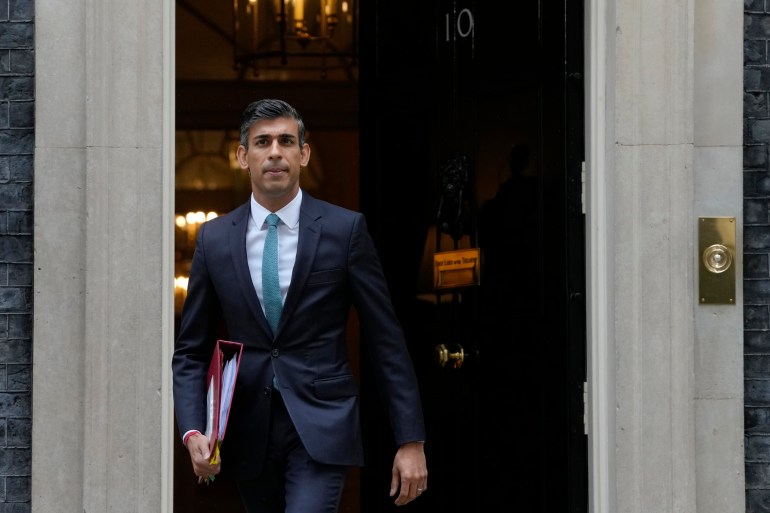 British Prime Minister Rishi Sunak is seen in front of his 10 Downing Street office