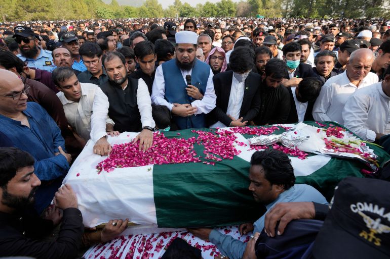 People attend the funeral prayer of slain senior Pakistani journalist Arshad Sharif, in Islamabad