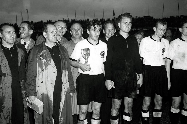 West Germany's captain Fritz Walter holds the Jules Rimet Gold Cup at Berne, Switzerland, July 4, 1954, after West Germany defeated tournament favourites Hungary 3-2 in the World Cup final