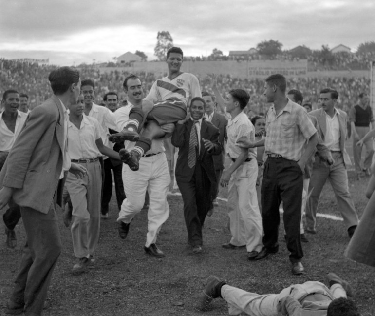 U.S. center forward Joe Gaetjens is carried off by cheering fans after his team beat England 1-0 in the World Cup.