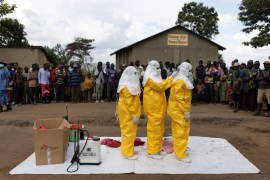 Red Cross workers don PPE prior to burying a three-year-old boy suspected of dying from Ebola on October 13, 2022 in Mubende, Uganda [File: Luke Dray/Getty Images]