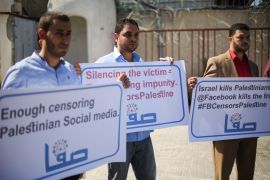 Palestinian demonstrators hold banners during a protest against blocking of Facebook to Palestinian's accounts in front of the Office of United Nations Special Coordinator for the Middle East Peace Process (UNSCO) in Gaza City.