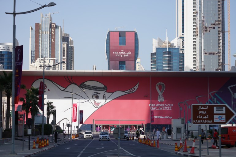 A sign with La’eeb, official mascot for the FIFA World Cup Qatar 2022, is seen in Doha, Qatar.