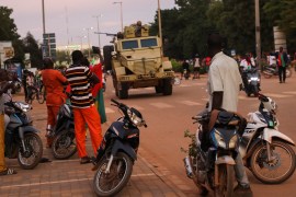 An armoured vehicle moves along a street after the French embassy was set on fire in Ouagadougou, Burkina Faso, 01 October 2022.