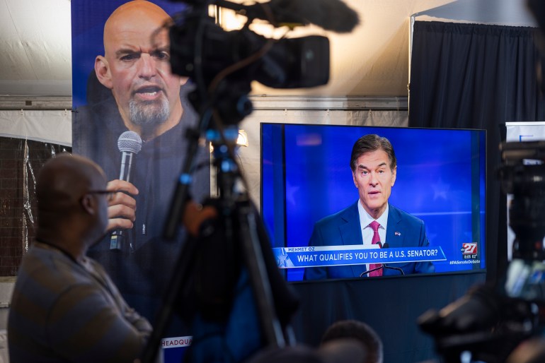 Members of the media watch Republican candidate Mehmet Oz on a TV monitor as he faces off against Democratic Senate candidate for Pennsylvania John Fetterman during the candidates' only debate in Harrisburg, Pennsylvania, USA, 25 October 2022