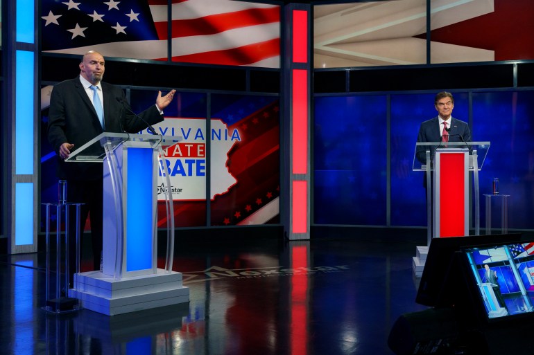 epa10266298 A handout photo made available by abc27 shows Democratic candidate Lt. Gov. John Fetterman (L) and Republican Pennsylvania Senate candidate Dr. Mehmet Oz (R) during the Nexstar Pennsylvania Senate Debate at WHTM abc27 in Harrisburg, Pennsylvania, USA, 25 October 2022