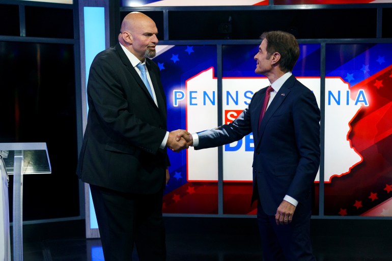 epa10266301 A handout photo made available by abc27 shows Democratic candidate Lt. Gov. John Fetterman (L) and Republican Pennsylvania Senate candidate Dr. Mehmet Oz (R) shaking hands prior to the Nexstar Pennsylvania Senate Debate at WHTM abc27 in Harrisburg, Pennsylvania, USA, 25 October 2022.