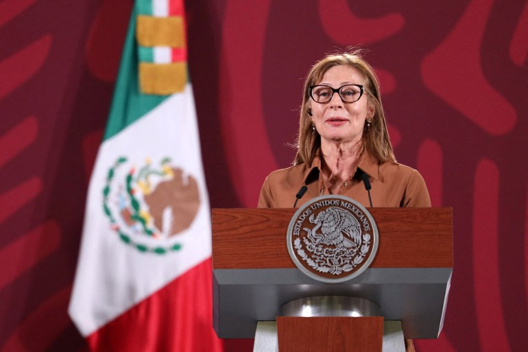 Mexican Economy Minister Tatiana Clouthier announces that she is stepping down from her post, next to Mexico's President Andres Manuel Lopez Obrador (not pictured) during a news conference at the National Palace in Mexico City, Mexico
