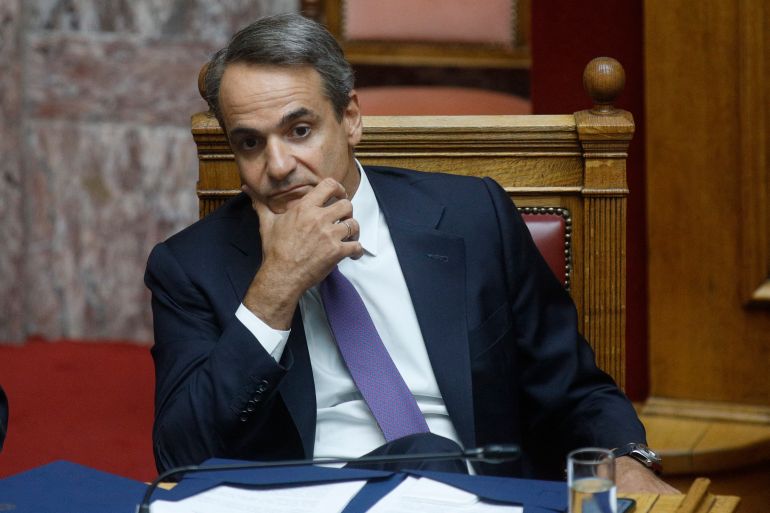 Greek Prime Minister Kyriakos Mitsotakis attends a parliament session in Athens on August 26, 2022. - The wiretapping affair exploded in Greece at the end of July after Nikos Androulakis, leader of the third parliamentary party, the socialist Pasok-Kinal, took legal action for "attempting" to monitor his mobile phone via the illegal software Predator. (Photo by Aris MESSINIS / Eurokinissi / AFP)