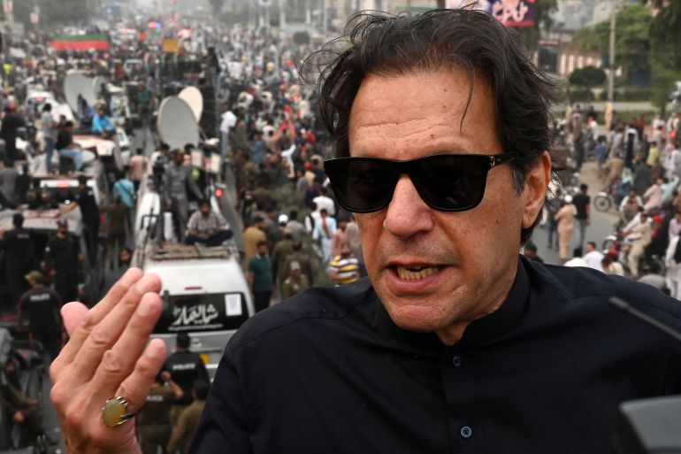 Pakistan's former prime minister Imran Khan speaks while taking part in an anti-government march