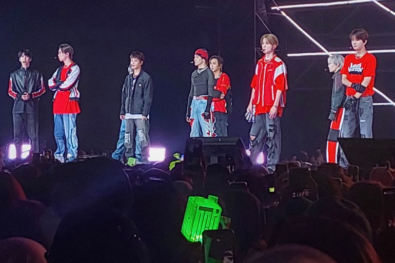 This picture taken on November 4, 2022 shows members of K-pop music group NCT127 performing in Serpong, Banten province