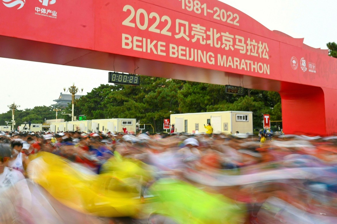 Participants taking off from the starting line in the Beijing Marathon.