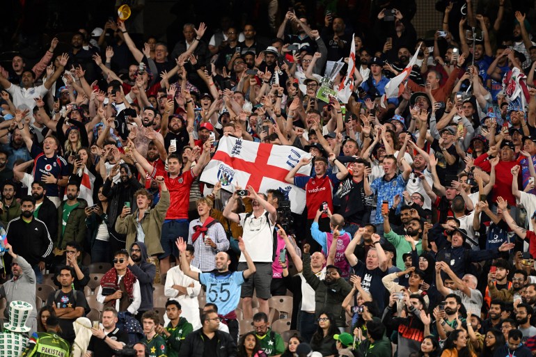 England supporters celebrate after victory in the ICC men's Twenty20 World Cup 2022 final cricket match England and Pakistan at The Melbourne Cricket Ground (MCG) in Melbourne on November 13, 2022.