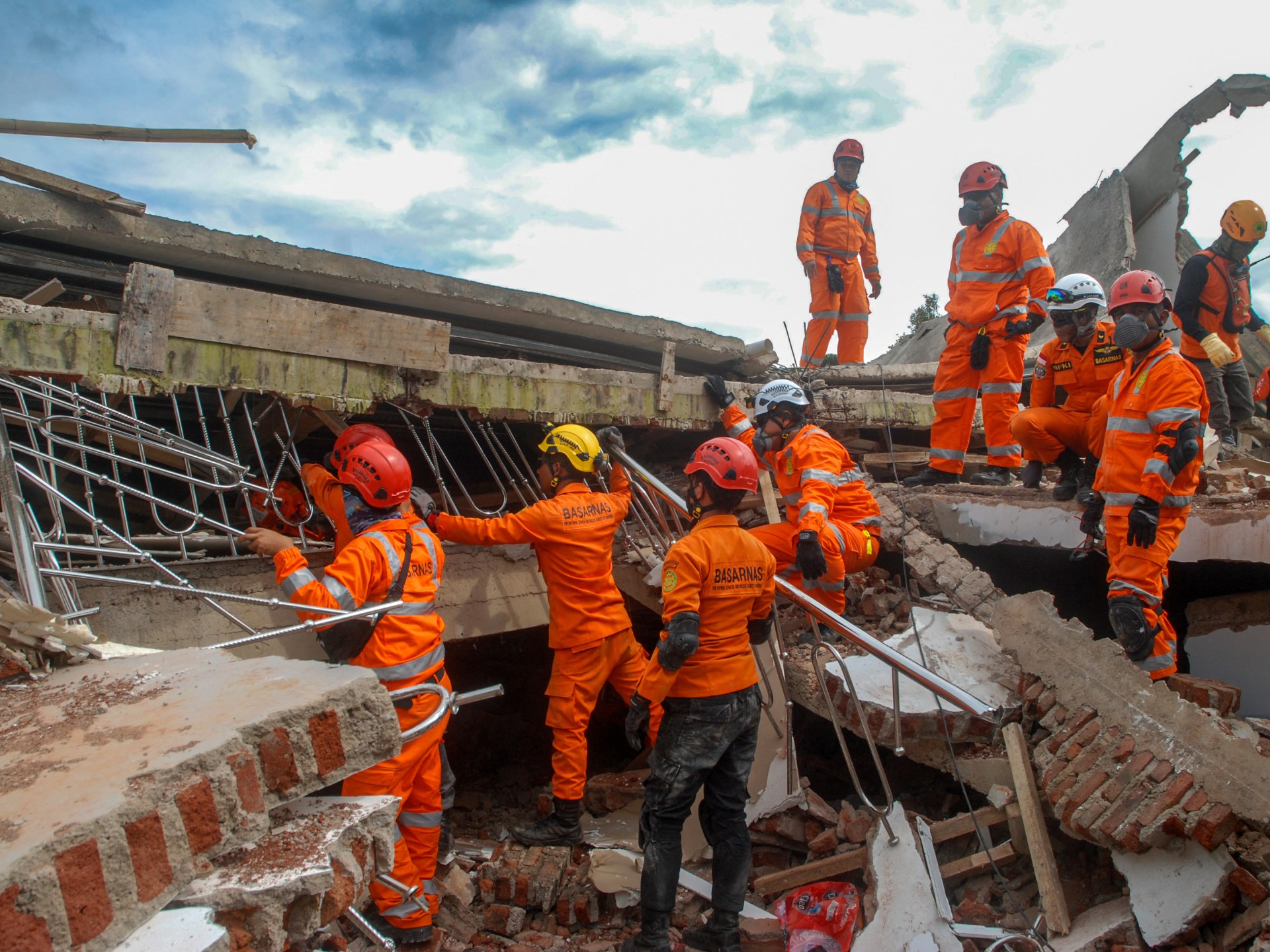 Six-year-old boy pulled alive from rubble of Indonesia quake