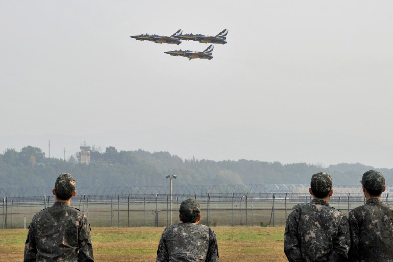 Three South Korean fighter jets take off during an air show at a military air base in Cheongju, South Korea.