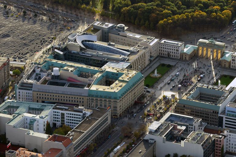 An aerial view over the British embassy (centre L) Hotel Adlon (lower L) the Acadamy of Arts and the U.S. Embassy (top) between the Holocaust memorial (top L) and the public square Pariser Platz with the Brandenburg Gate (top R) towards the Tiergarten in Berlin October 18, 2013. Documents leaked by former U.S. National Security Agency contractor Edward Snowden show that Britain's surveillance agency is operating a network of "electronic spy posts" from within a stone's throw of the Bundestag and German chancellor's office, the Independent reported. NSA documents, in conjunction with aerial photographs and information about past spying activities in Germany, suggest that Britain is operating its own covert listening station close to the German parliament, and Chancellor Angela Merkel's offices in the Chancellery, using hi-tech equipment housed on the embassy roof, the British newspaper reported. Picture taken October 18. REUTERS/Euroluftbild.de/Robert Grahn (GERMANY - Tags: CITYSPACE POLITICS)