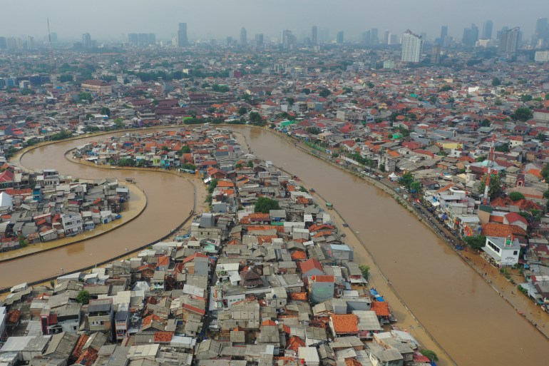 Skyline shot of an area affected by floods, next to Ciliwung river in Jakarta, Indonesia.