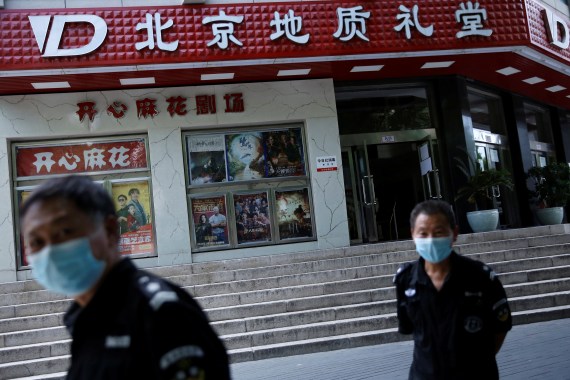 Security guards wearing face masks OUTSIDE BEIJING CINEMA