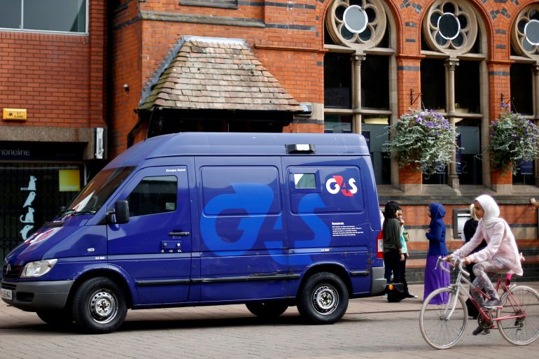 A G4S security van is seen parked outside a bank in Loughborough