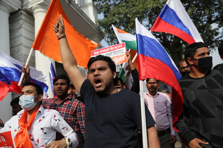 Activists of Hindu Sena, a Hindu right-wing group, hold placards and flags as they take part in a march in support of Russia, as the invasion of Ukraine continues, in Connaught Place, in New Delhi, India, March 6, 2022. REUTERS/Anushree Fadnavis