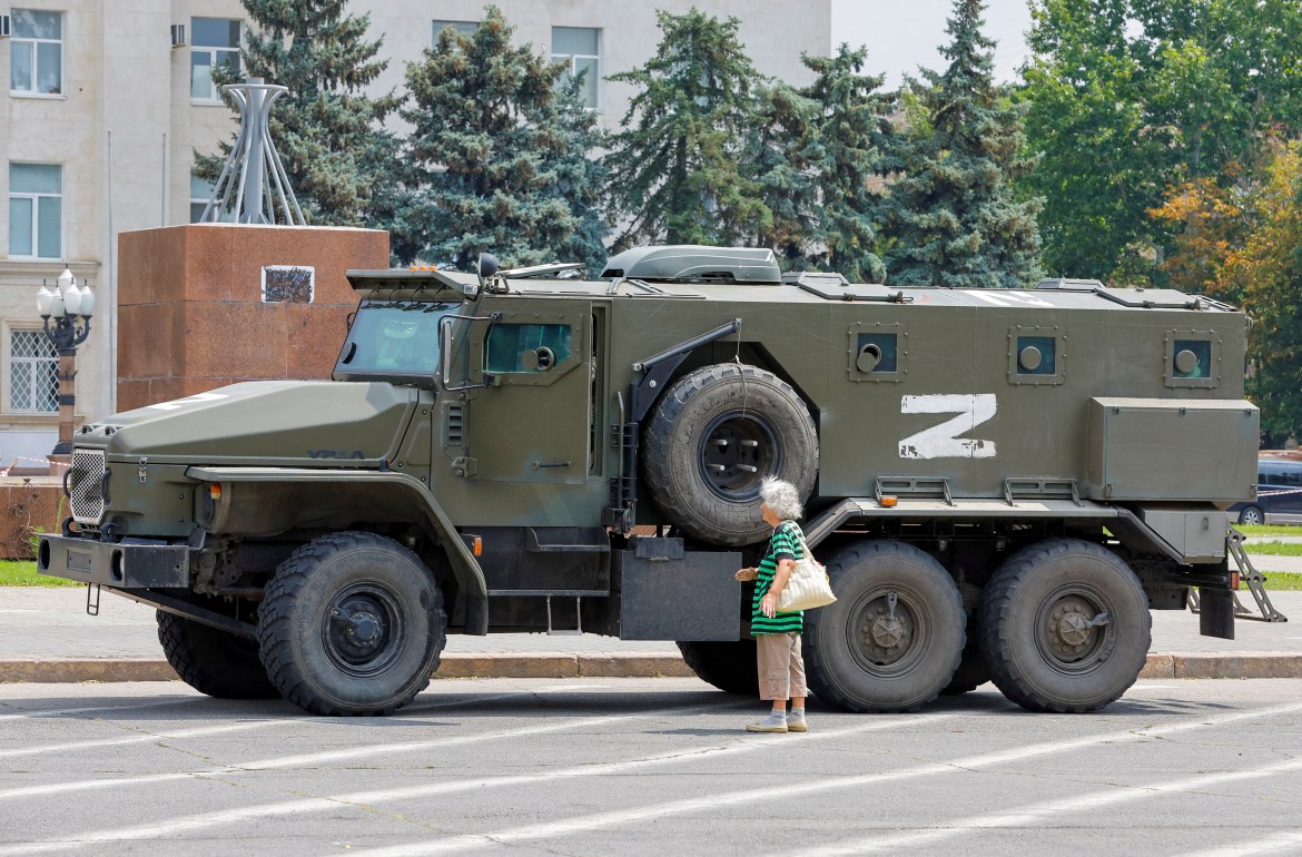 An armoured truck of pro-Russian troops is parked.
