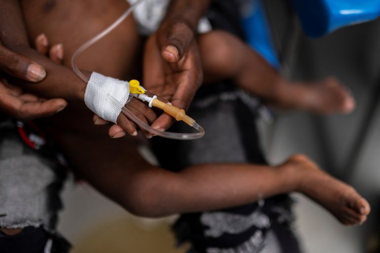 A child gets treatment for cholera in Haiti