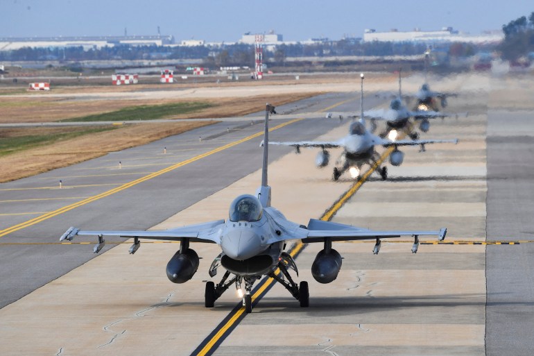 South Korean airforce KF-16 fighter jets taxiing down a runway